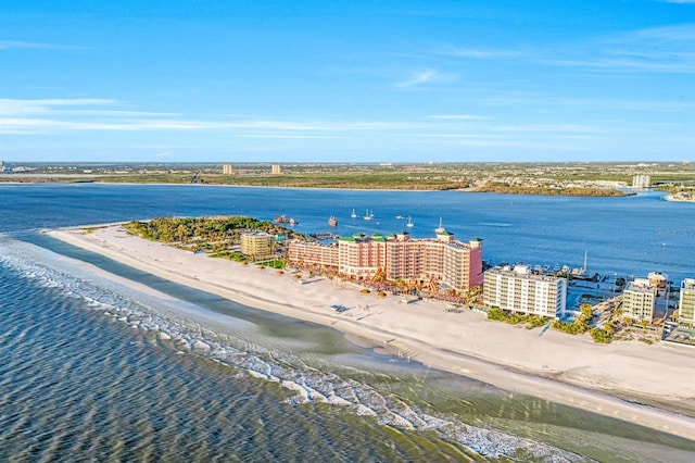 drone / aerial view featuring a beach view and a water view