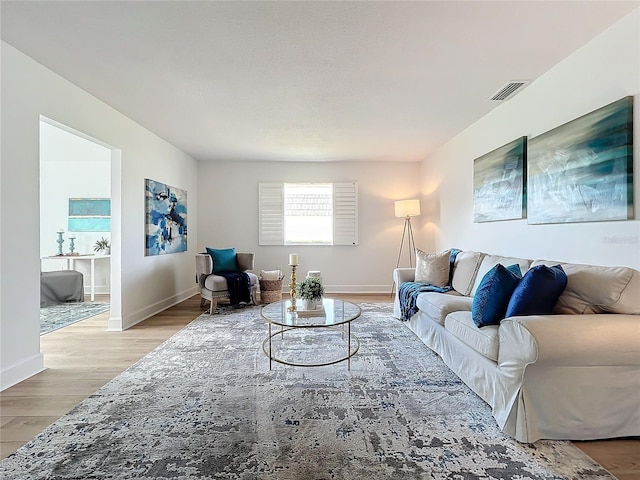 living room with light hardwood / wood-style flooring