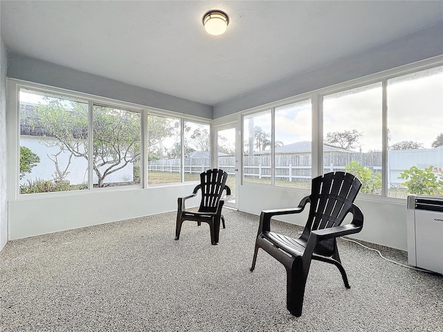 sunroom / solarium with a water view