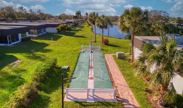 surrounding community featuring a yard and a water view