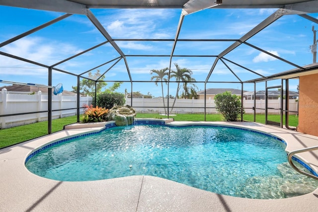 view of swimming pool featuring a lanai, pool water feature, and a lawn