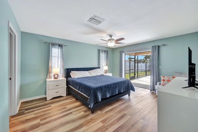 bedroom with multiple windows, access to outside, light hardwood / wood-style flooring, and ceiling fan