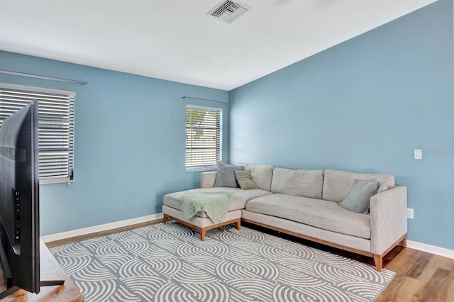 living room with light hardwood / wood-style flooring