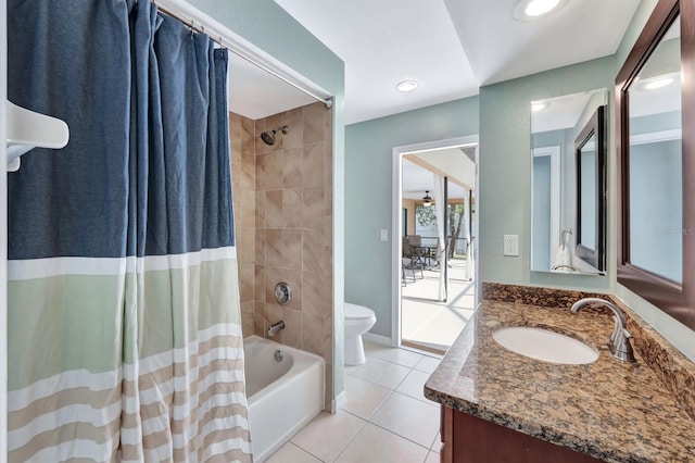 full bathroom with toilet, shower / tub combo with curtain, vanity, and tile patterned flooring