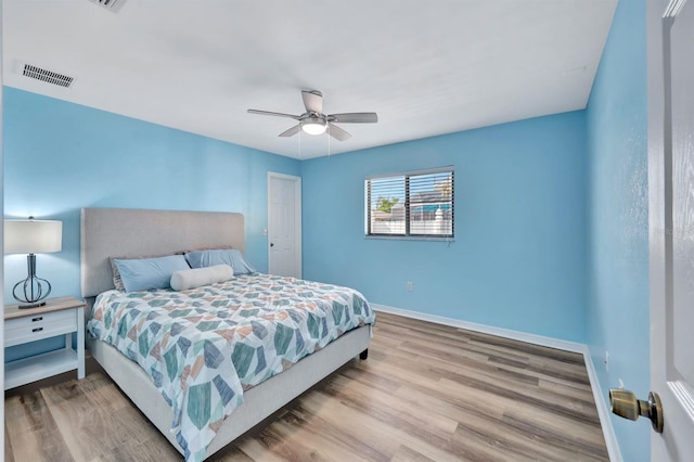 bedroom featuring ceiling fan and light wood-type flooring