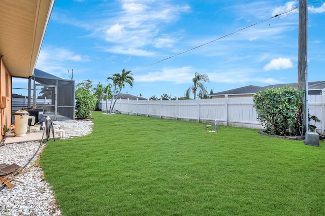 view of yard featuring glass enclosure