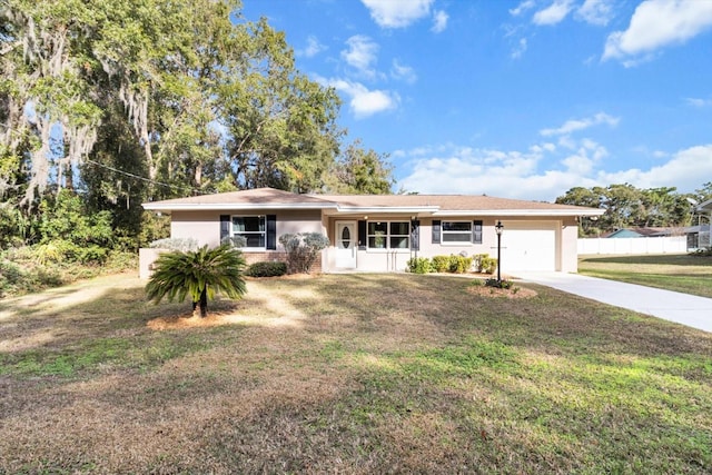 ranch-style house with a garage and a front lawn