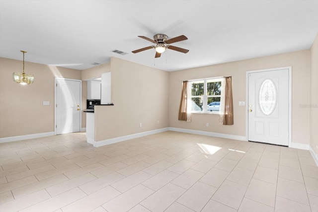 foyer featuring ceiling fan with notable chandelier