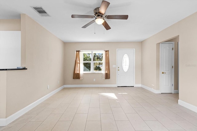 foyer entrance featuring ceiling fan