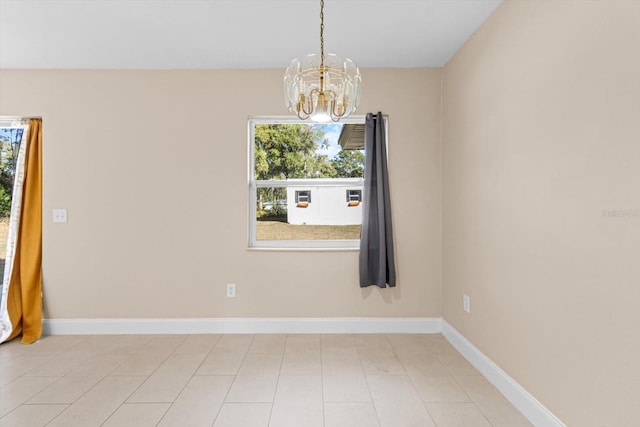 empty room with an inviting chandelier