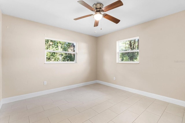 unfurnished room featuring ceiling fan and light tile patterned floors