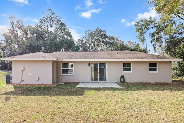 rear view of house featuring a patio area, a yard, and cooling unit