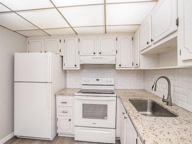 kitchen featuring decorative backsplash, a drop ceiling, white appliances, sink, and white cabinets