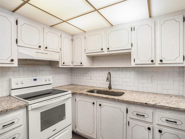 kitchen with decorative backsplash, white cabinetry, sink, and white electric stove