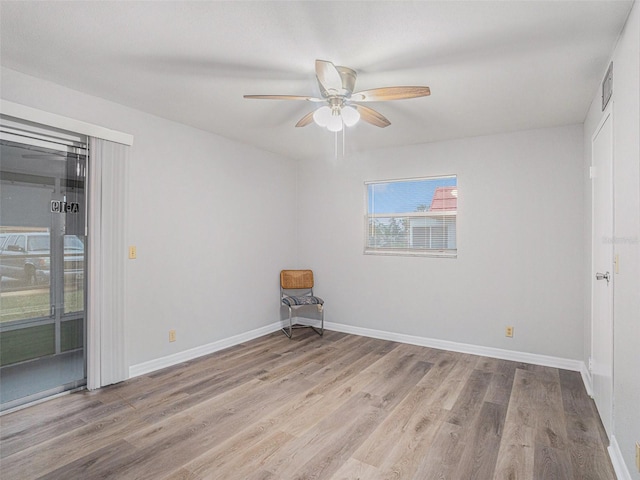 unfurnished room with ceiling fan and light hardwood / wood-style floors