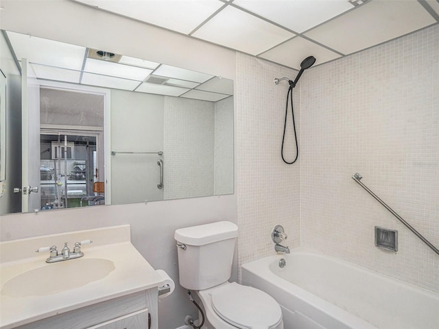 full bathroom featuring toilet, vanity, and tiled shower / bath combo