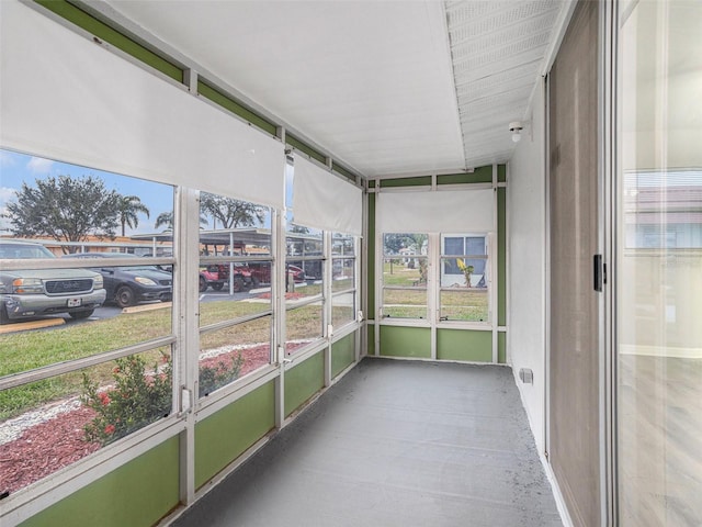 unfurnished sunroom with vaulted ceiling