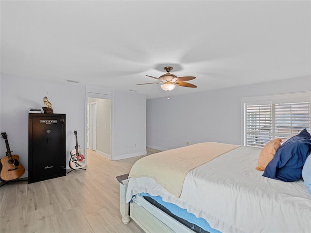 bedroom featuring light wood-type flooring and ceiling fan