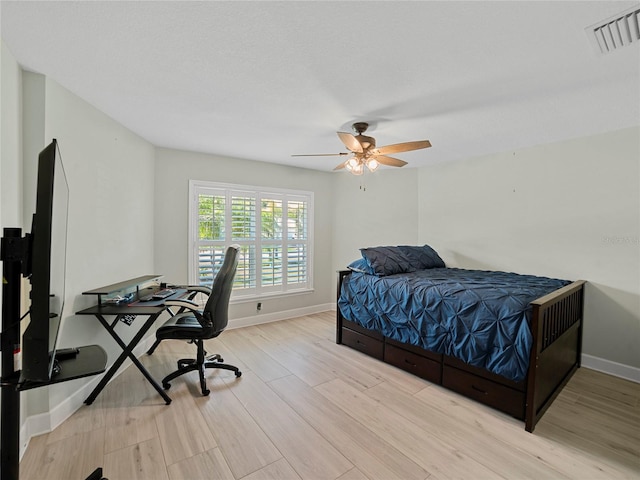 bedroom featuring light hardwood / wood-style flooring and ceiling fan