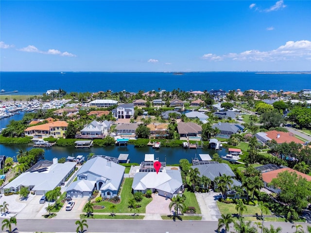 birds eye view of property featuring a water view