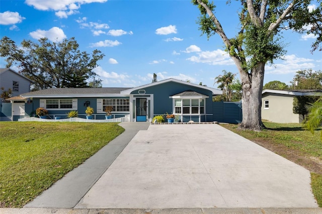 ranch-style house with a front lawn