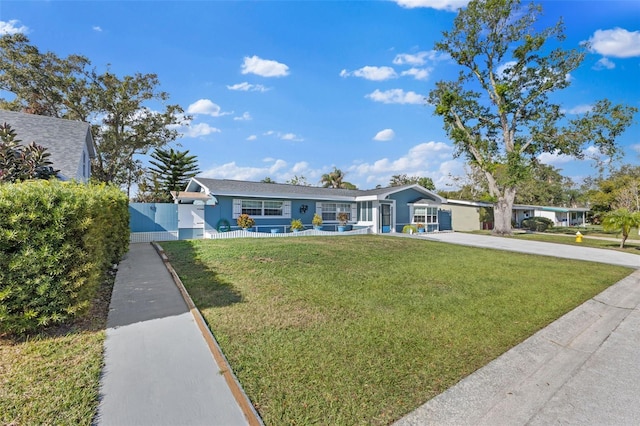 ranch-style home featuring a front yard