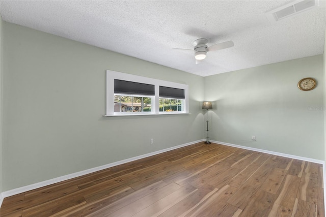 unfurnished room featuring hardwood / wood-style floors, a textured ceiling, and ceiling fan