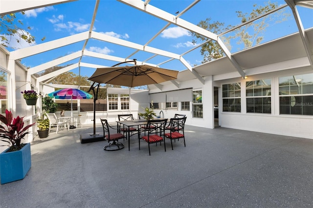 view of patio with glass enclosure