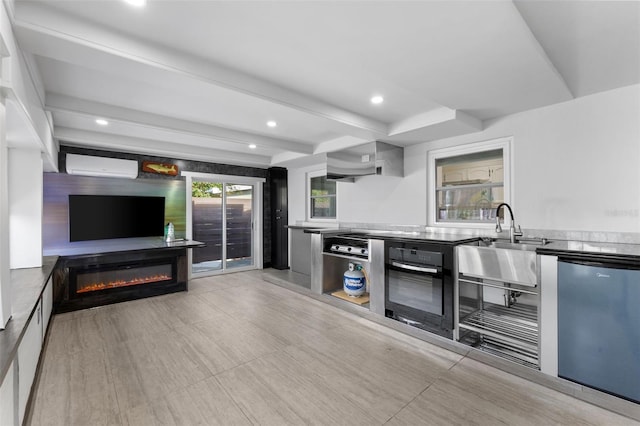 kitchen featuring beam ceiling, dishwasher, sink, a wall mounted air conditioner, and black oven