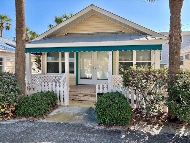 bungalow-style house with french doors