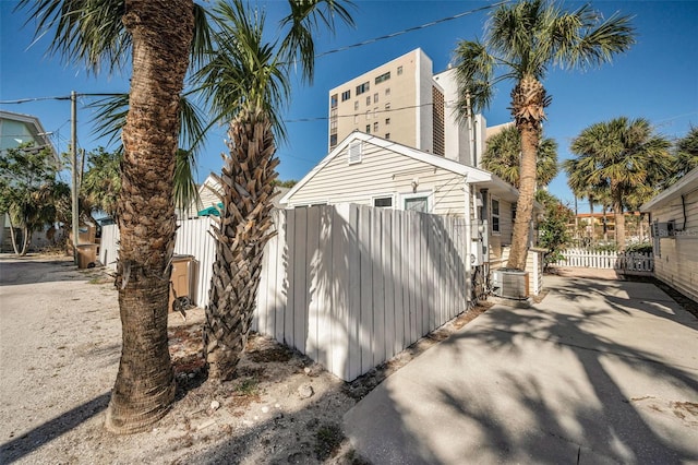 view of side of home featuring central air condition unit