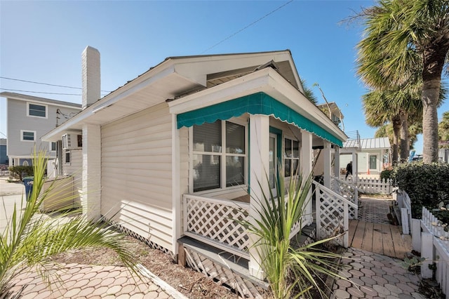 view of property exterior featuring a porch