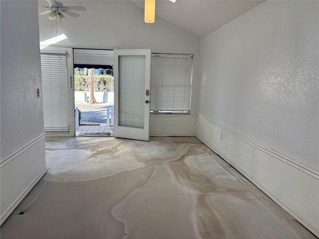 foyer with ceiling fan, french doors, and lofted ceiling