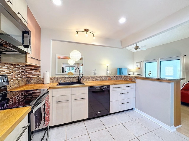 kitchen with black appliances, sink, kitchen peninsula, ceiling fan, and white cabinetry