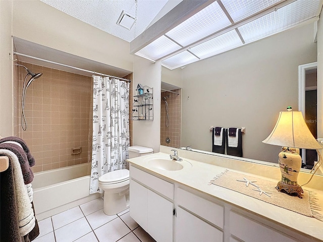 full bathroom with shower / bath combo, tile patterned floors, vanity, a textured ceiling, and toilet