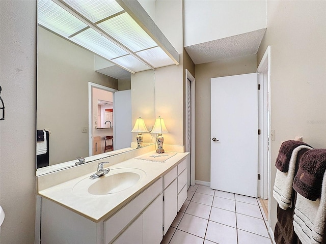 bathroom featuring tile patterned floors and vanity