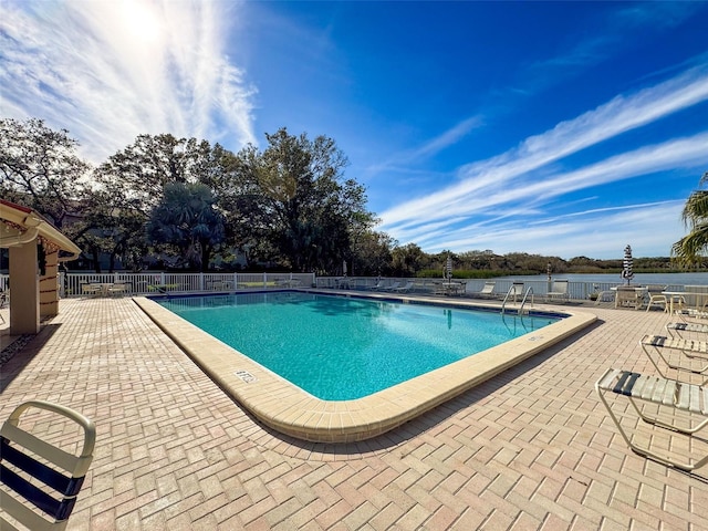 view of swimming pool with a patio