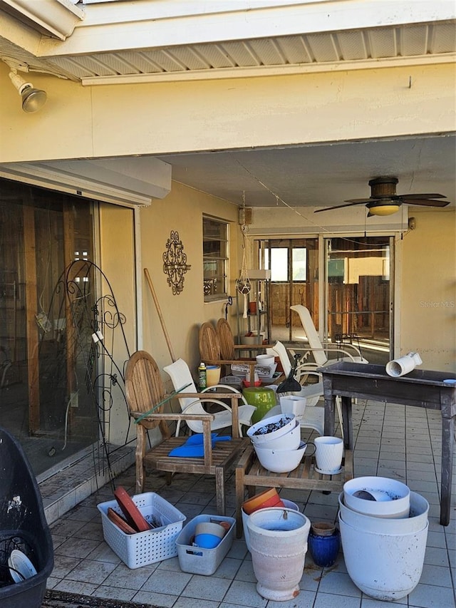 view of patio featuring ceiling fan