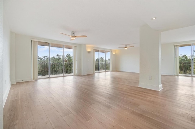 unfurnished room featuring ceiling fan and light hardwood / wood-style flooring