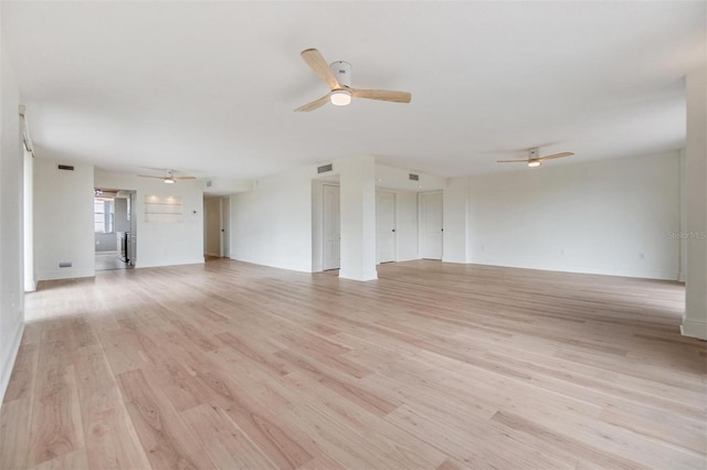 unfurnished living room featuring light hardwood / wood-style floors