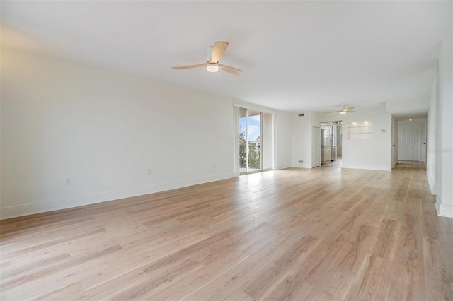 unfurnished living room with ceiling fan and light hardwood / wood-style flooring