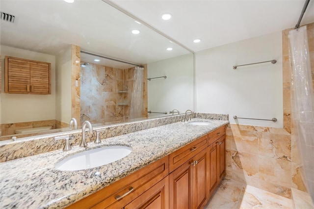 bathroom featuring vanity and independent shower and bath