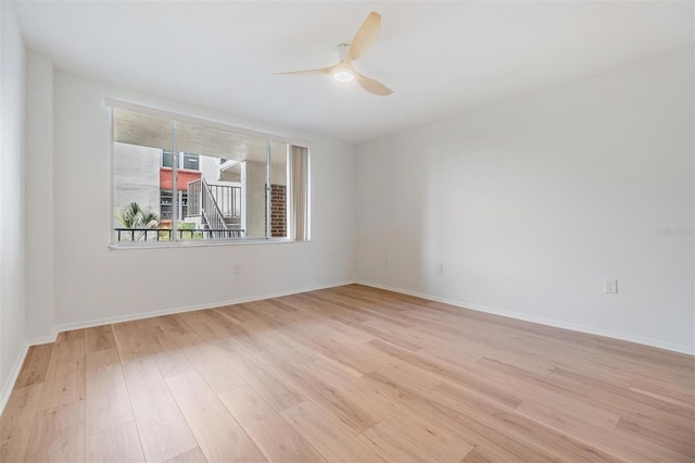 spare room with ceiling fan and light hardwood / wood-style floors