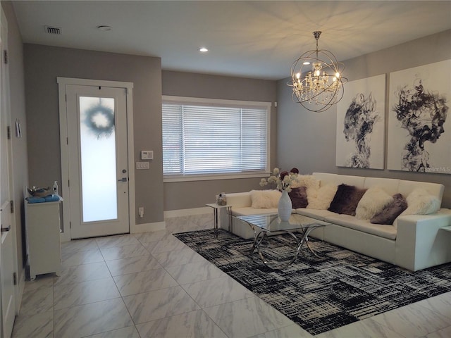 living room featuring a notable chandelier