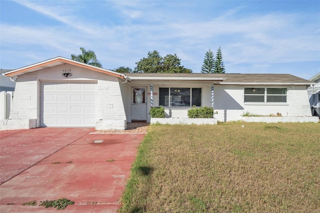 ranch-style house featuring a front lawn and a garage