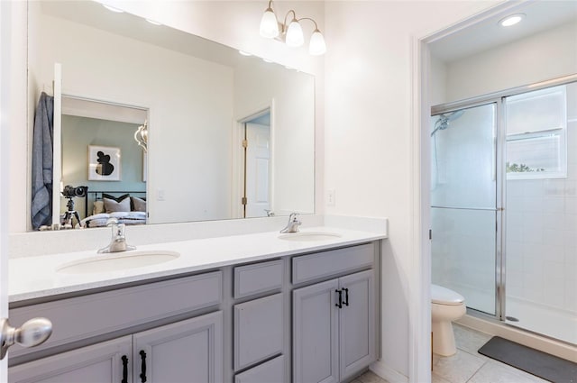 bathroom with walk in shower, tile patterned flooring, vanity, and toilet