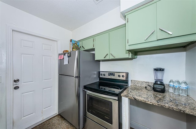 kitchen with stone counters, green cabinetry, and appliances with stainless steel finishes