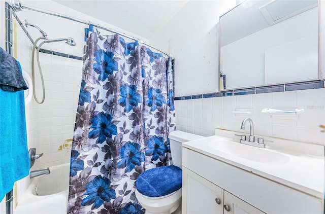 full bathroom featuring vanity, toilet, tile walls, and shower / tub combo