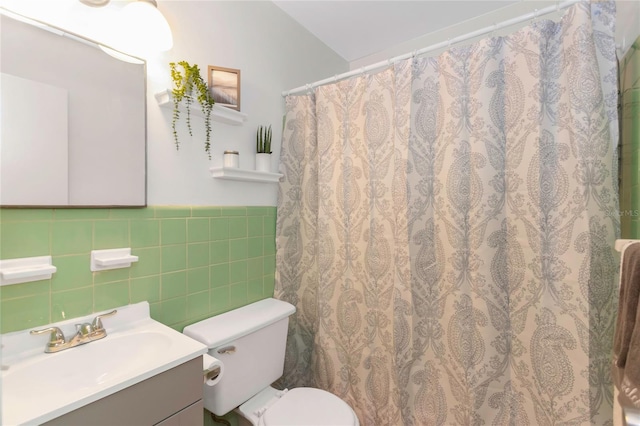 bathroom featuring a shower with curtain, vanity, toilet, and tile walls