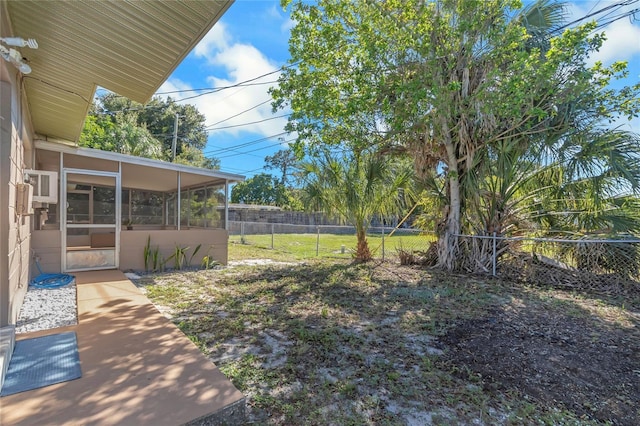 view of yard with a sunroom